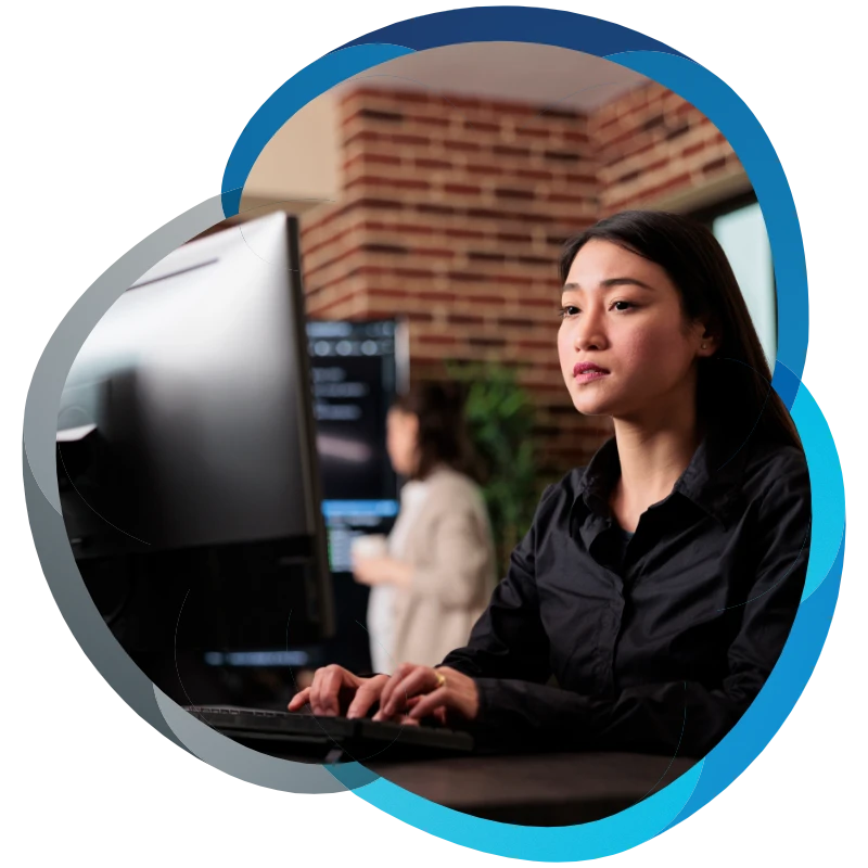 Lawyer in smart casual working at her computer in office